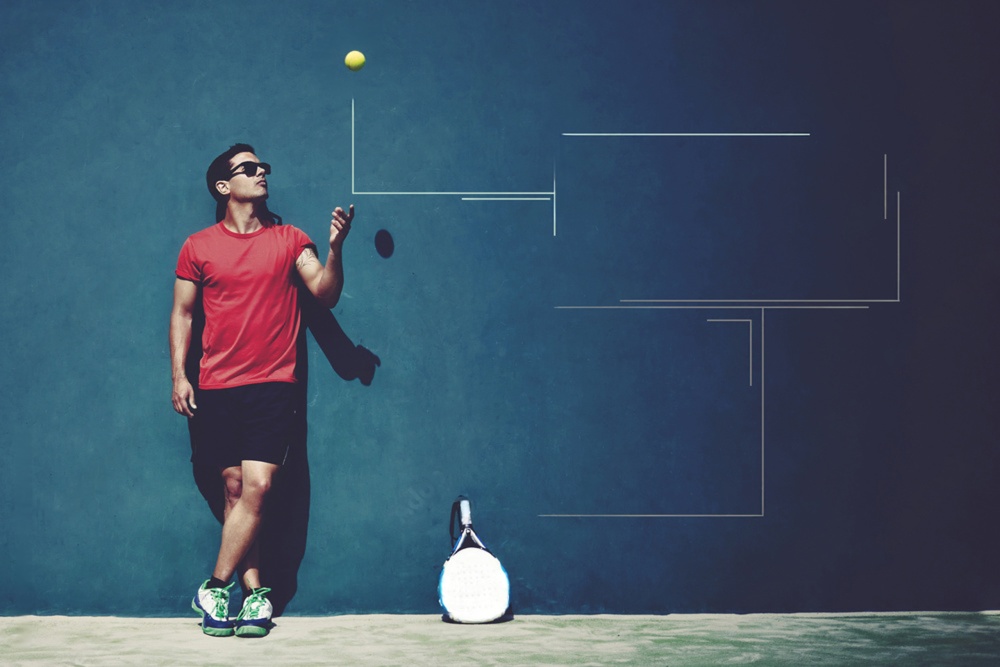 padel player against a wall and playing with a ball